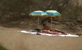 Swingers teasing on nudist beach