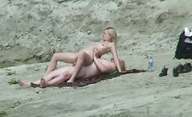 Blonde on the beach riding cock