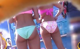 Admiring three booties in bikini